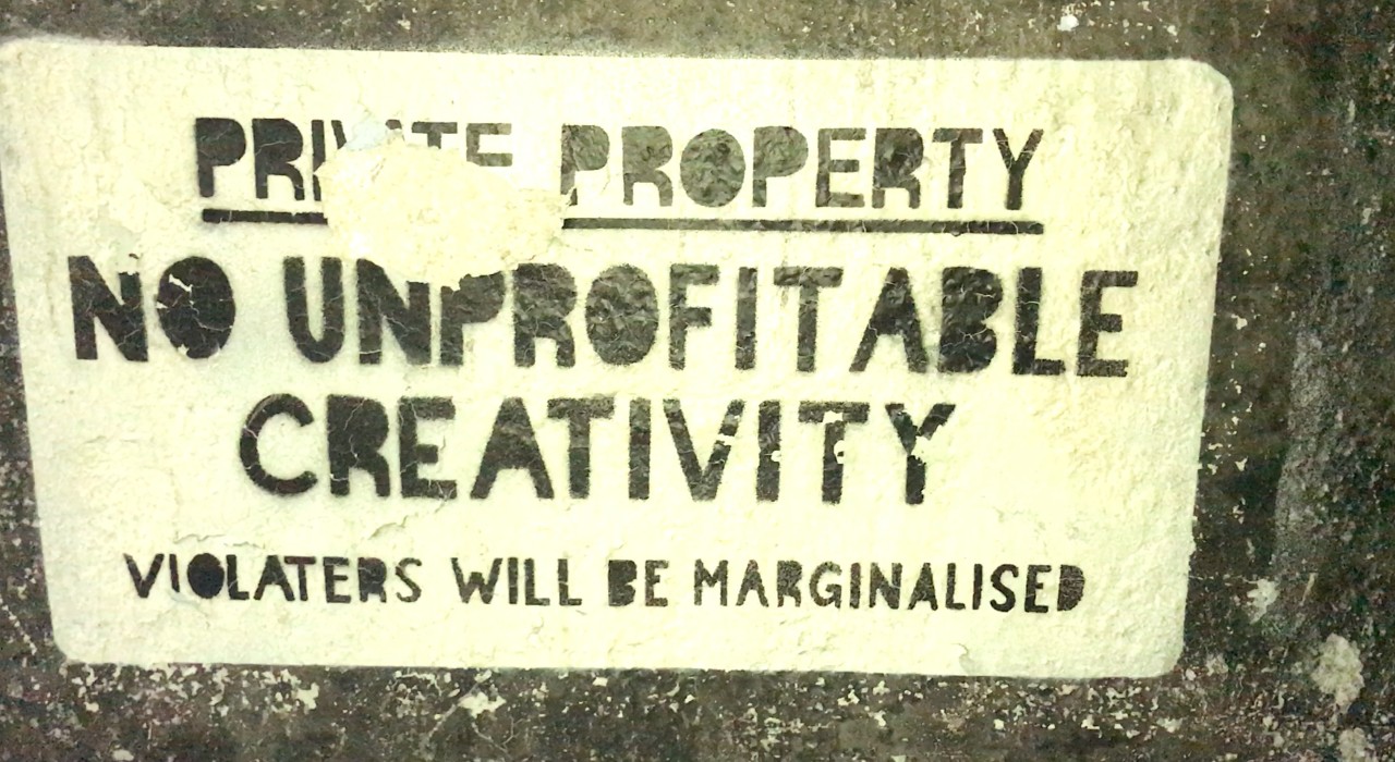 pic of graffiti that says: No unprofitable creativity