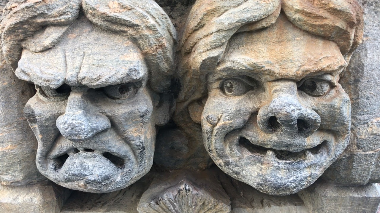 a pic of two stone gargoyles