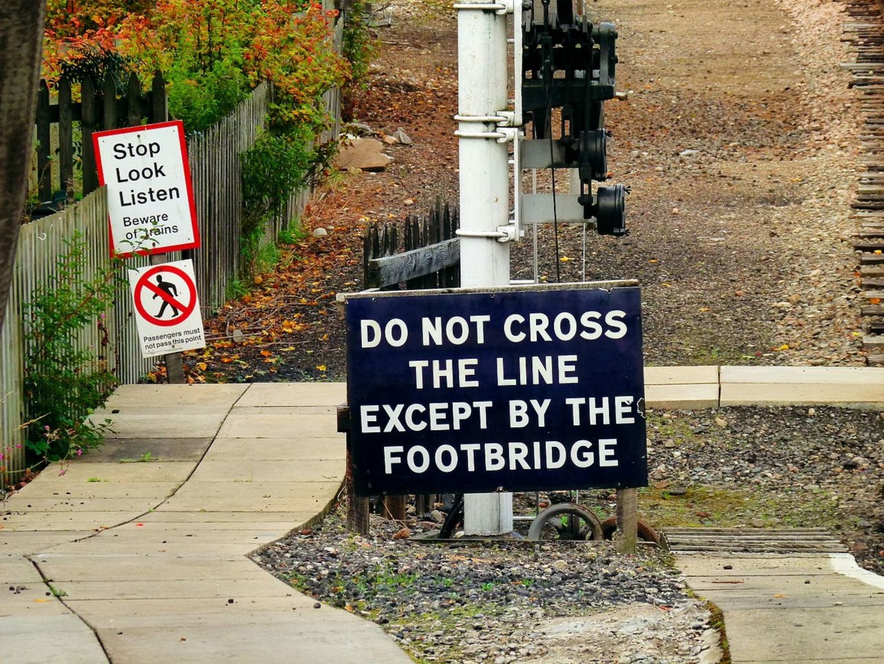 Grammar - Warning signs leading to a railroad crossing