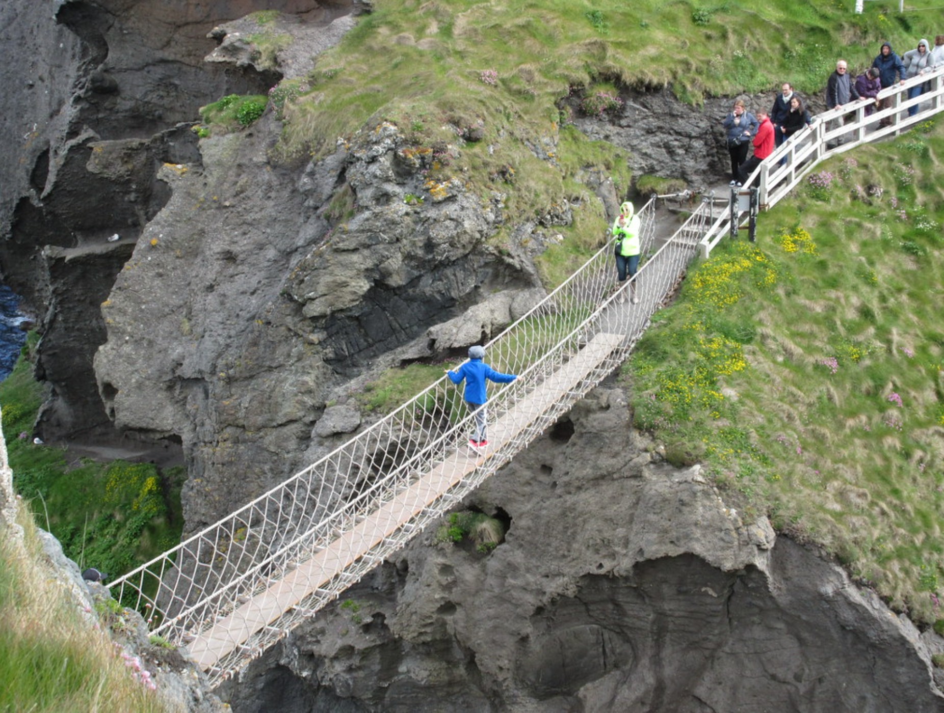 sentence types: people on a rope bridge traversing a ravine